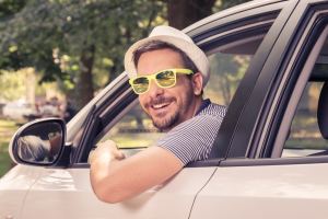 Young driver sitting in driver’s seat